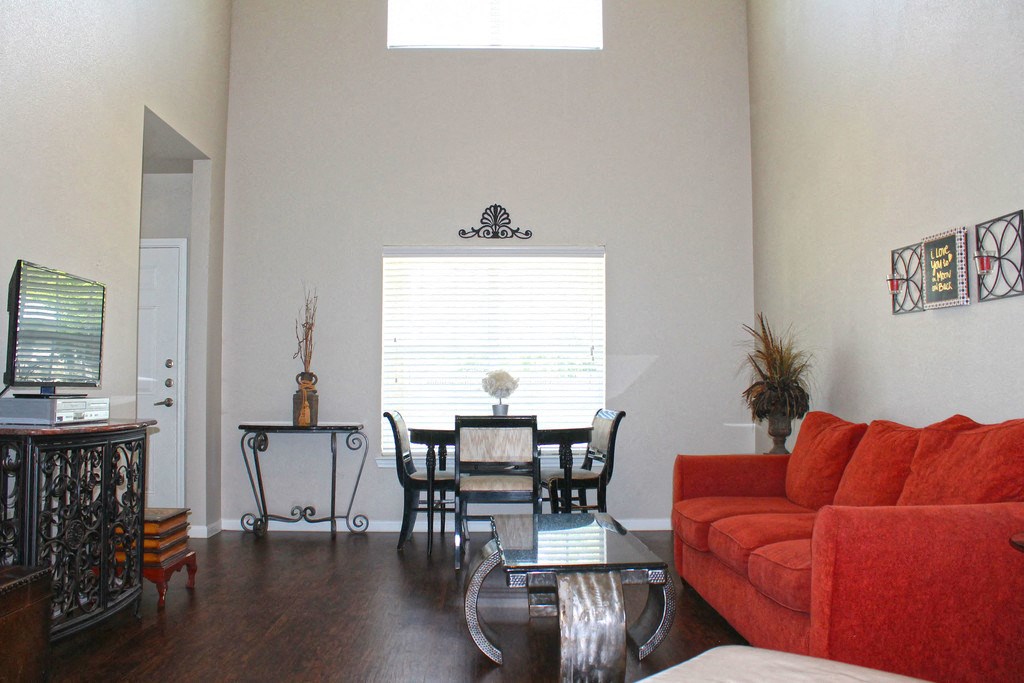 a living room and dining room with a couch and table