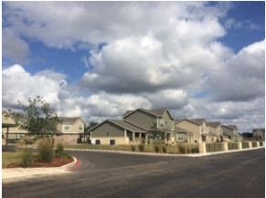 a row of houses on the side of a road