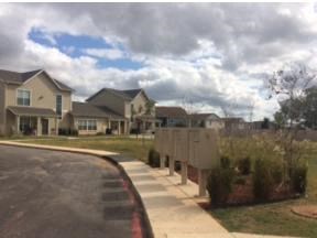 a row of houses on the side of a street