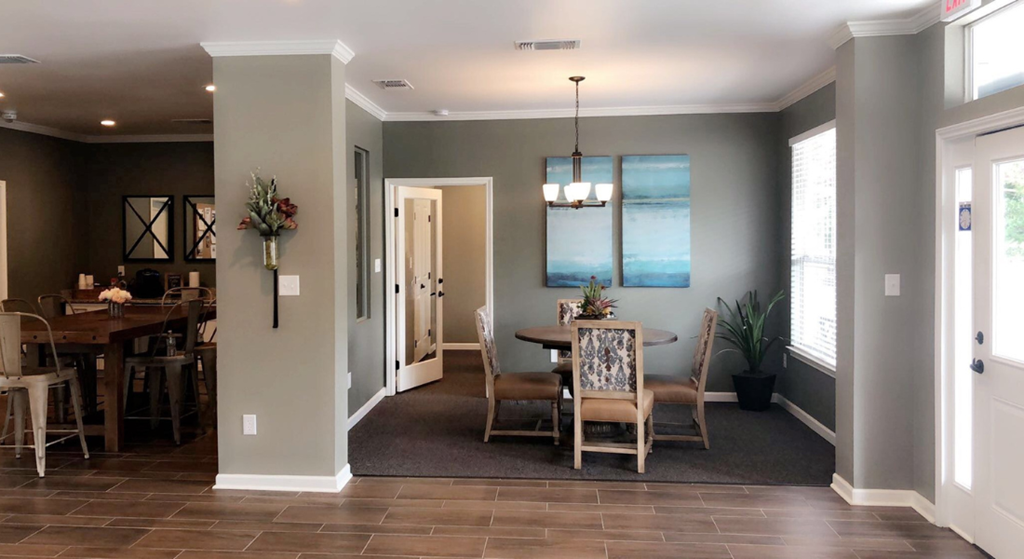 a dining room with a table and chairs