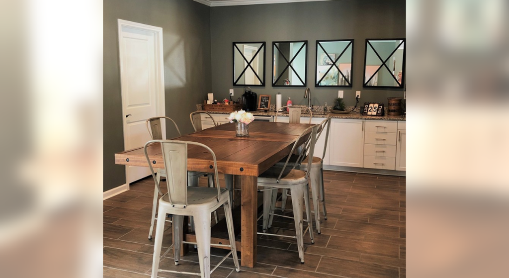 a dining room with a wooden table and chairs