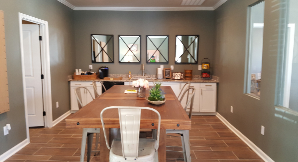 a dining room with a table and chairs and a kitchen