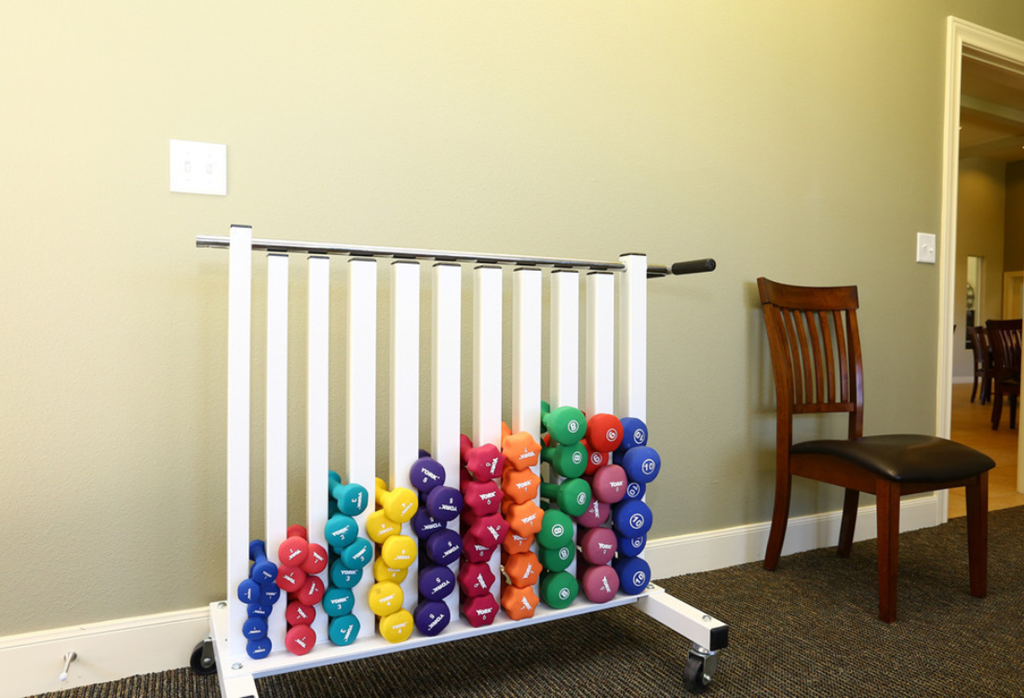 a childs gate with magnetic letters in a room with a chair