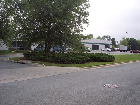 A tree is in front of a building.