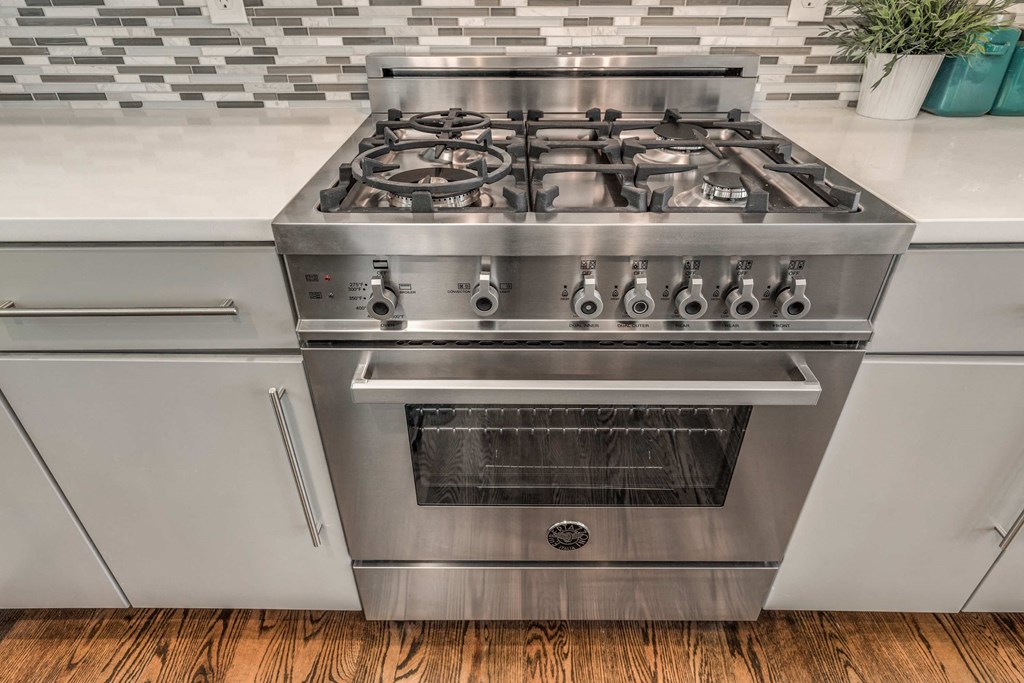 a stainless steel stove top oven in a kitchen