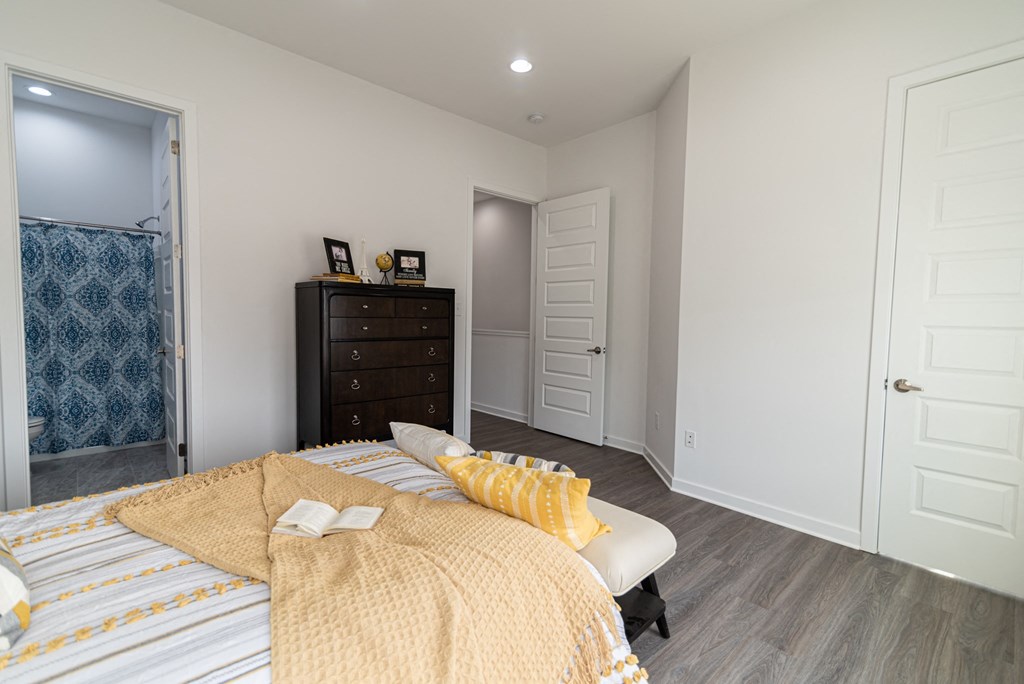 a bedroom with a bed and a closet