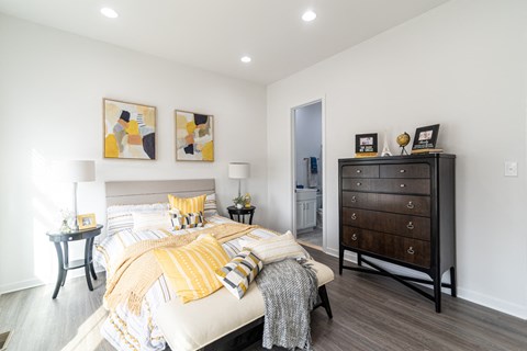 a bedroom with a bed and a dresser