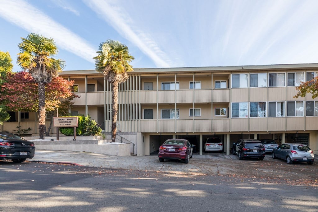 A building with a parking lot in front of it.