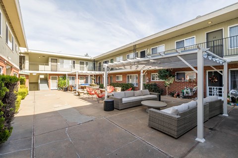 A sunny day at the outdoor patio of apartment buildings.