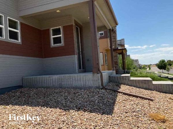 a house with a front porch and gravel