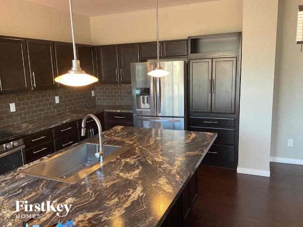 a kitchen with granite counter tops and a sink