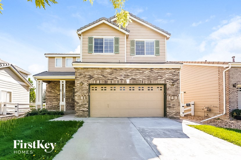 A house with a garage is for sale by FirstKey Homes.