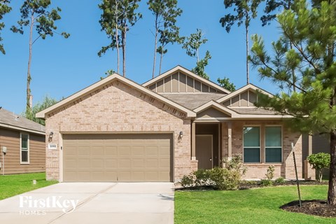 A house with a garage is for sale.
