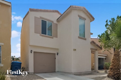a house with a palm tree in front of it