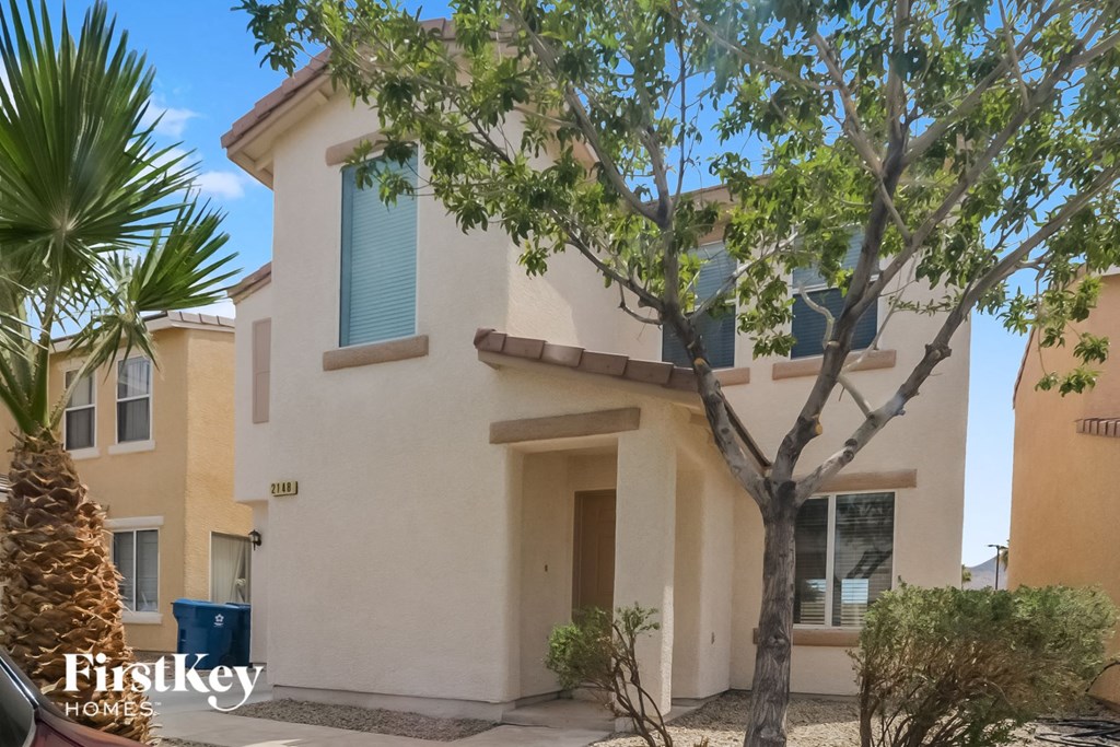 a house with a tree in front of it
