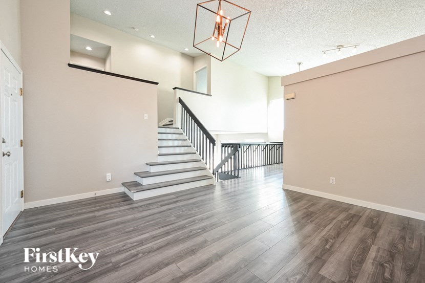a view of the lobby of a house with stairs and a staircase