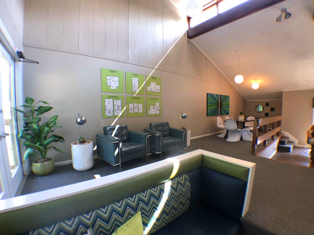 a living room with couches and chairs and a pool