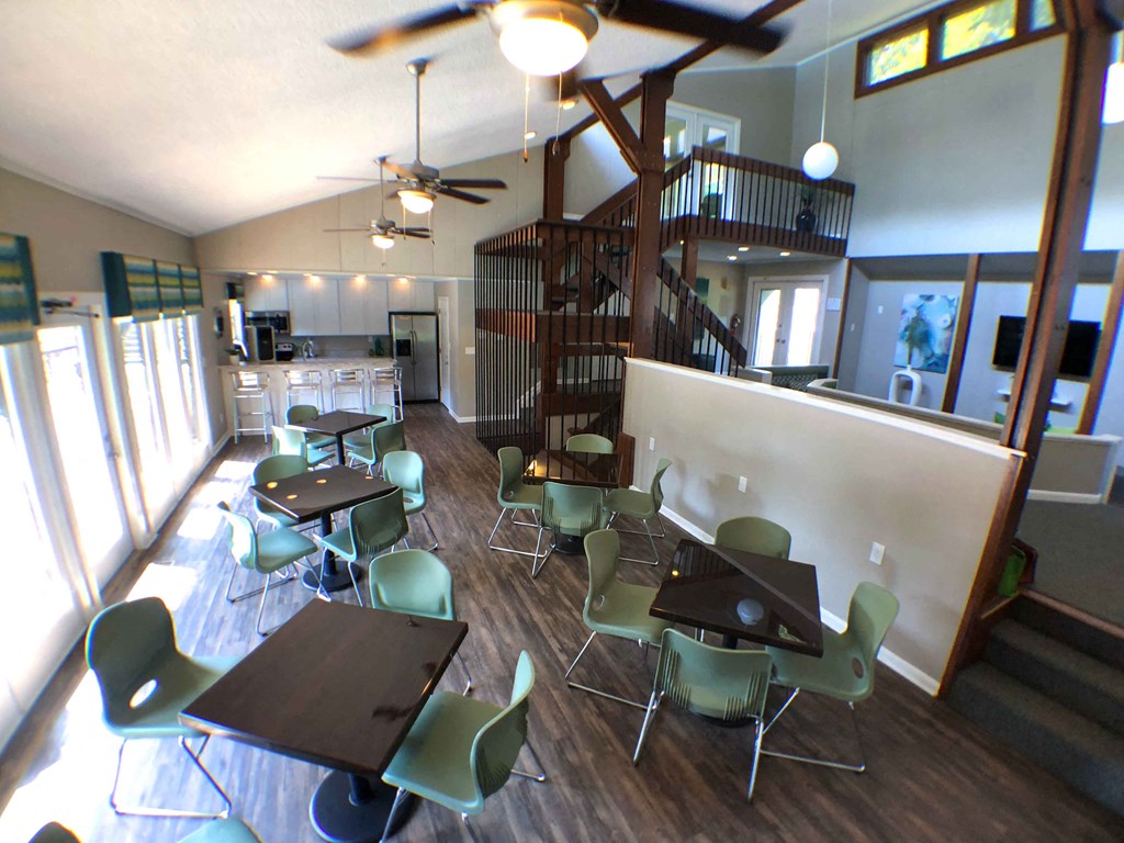 a dining room and living room with tables and chairs