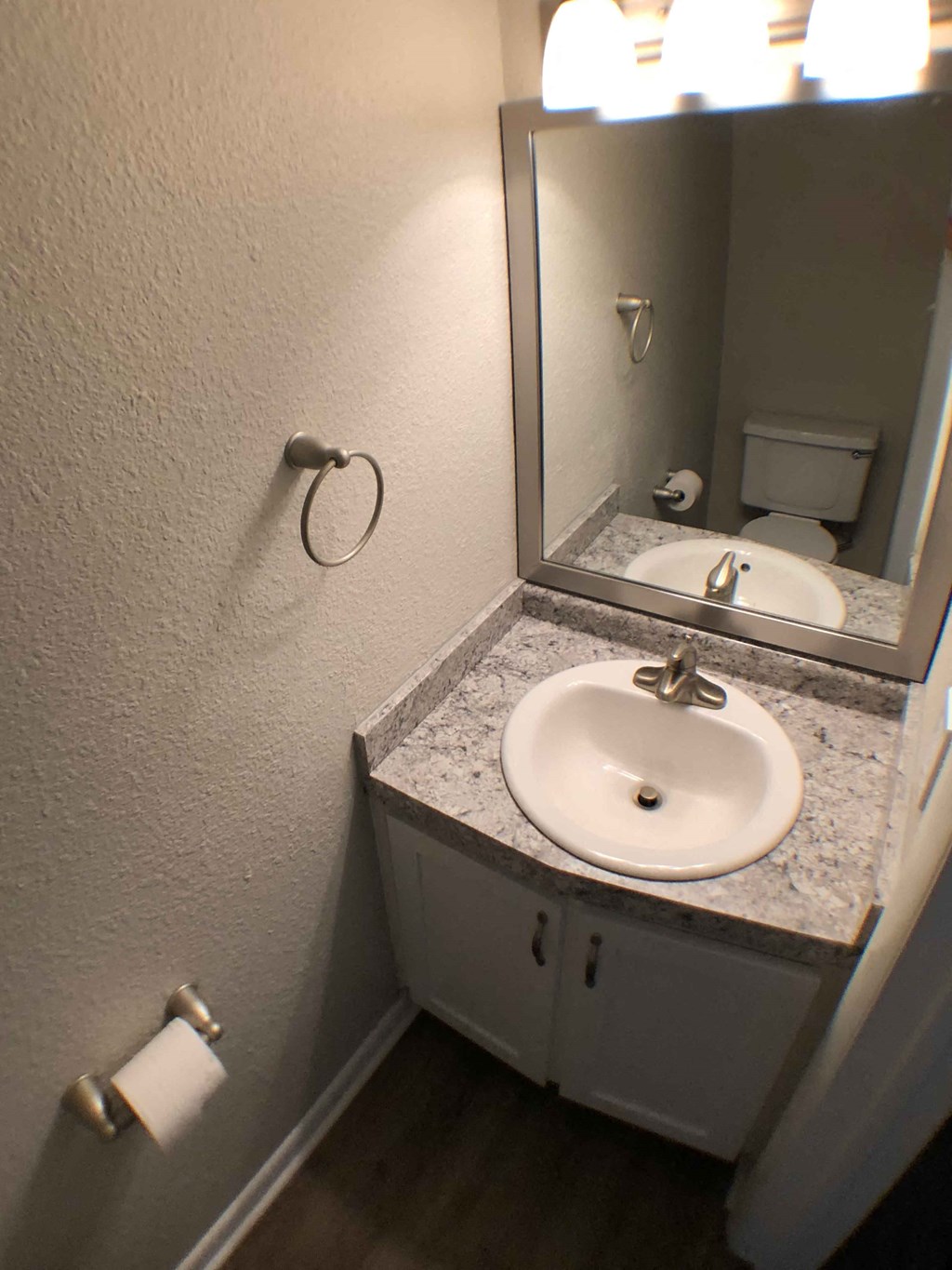 a small bathroom with a sink and a mirror