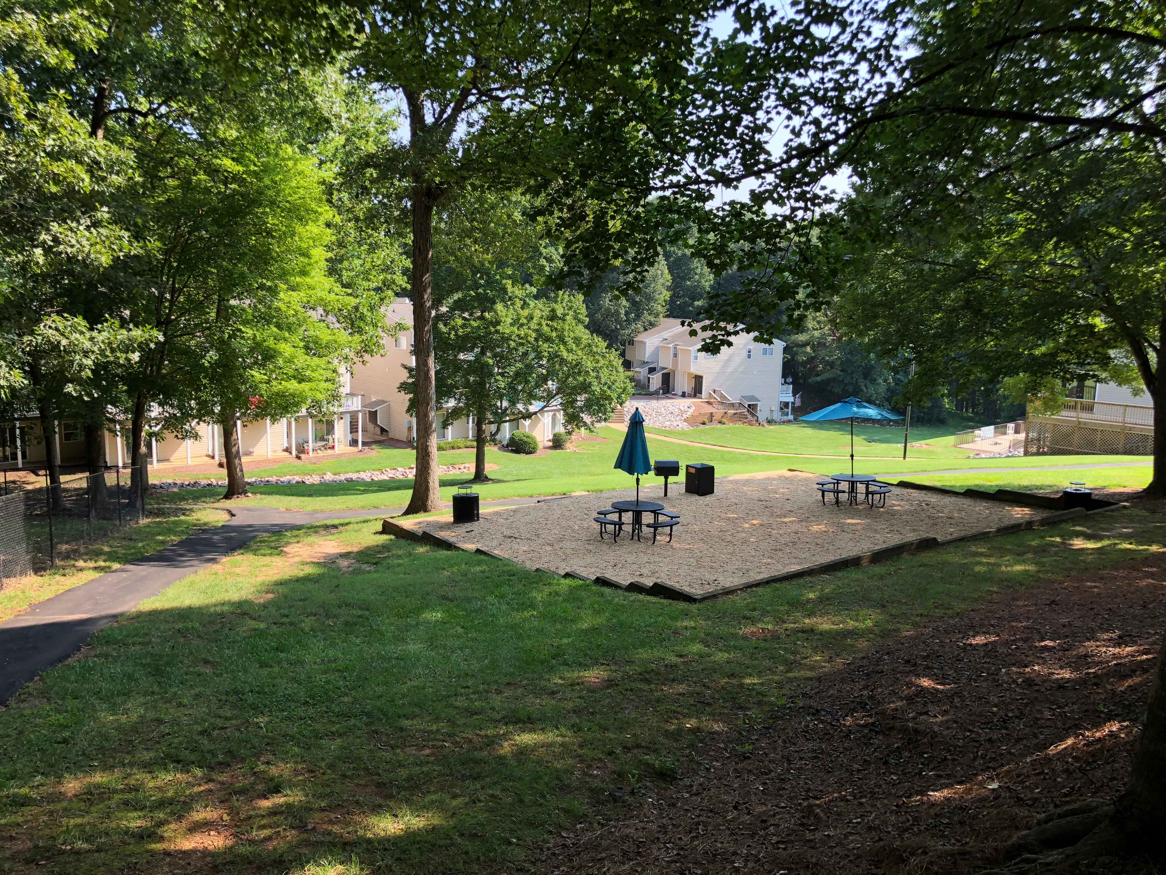 a park with a picnic area and trees