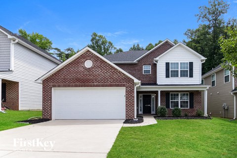 a brick house with a white garage door
