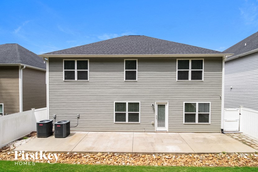 a with two trash cans in front of it