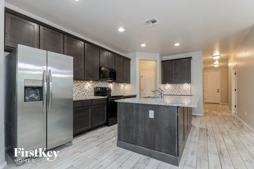 a kitchen with stainless steel appliances and a counter top