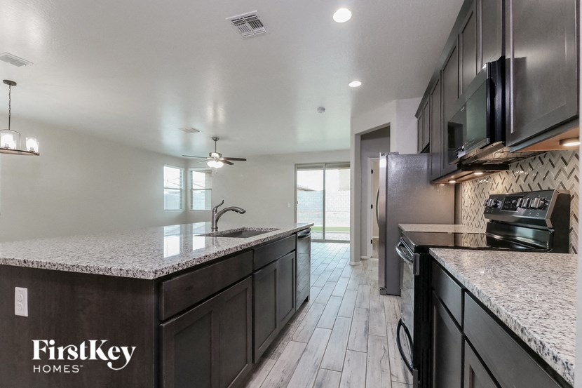 a kitchen with a counter top and a sink
