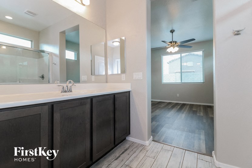 a bathroom with a large mirror and a sink