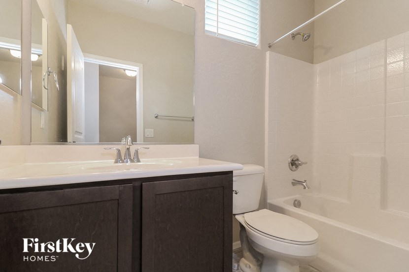 a bathroom with a sink toilet and a shower