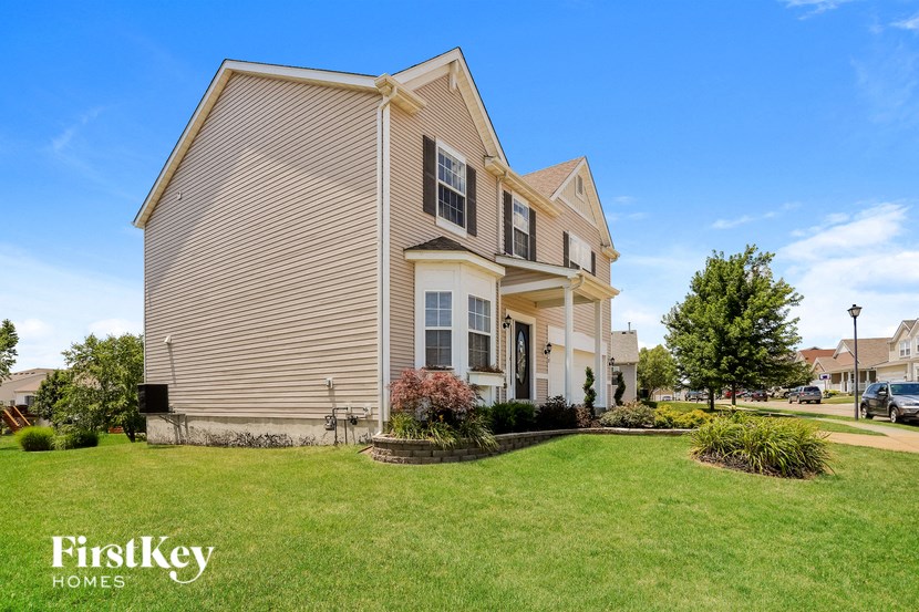 A house with a lawn in front of it.