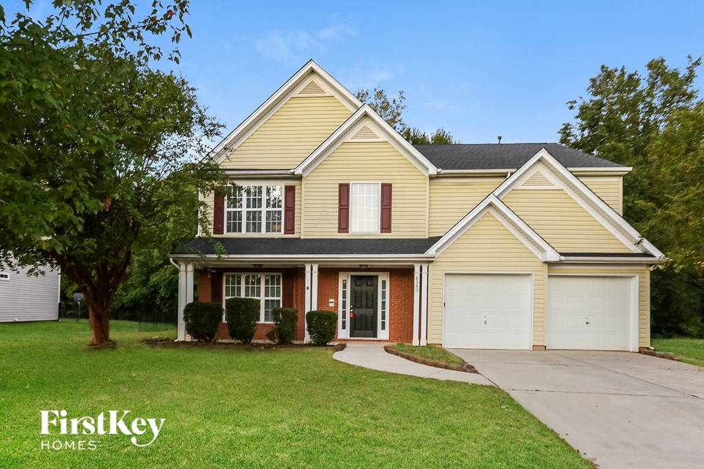 A two-story house with a garage is for sale by FirstKey Homes.