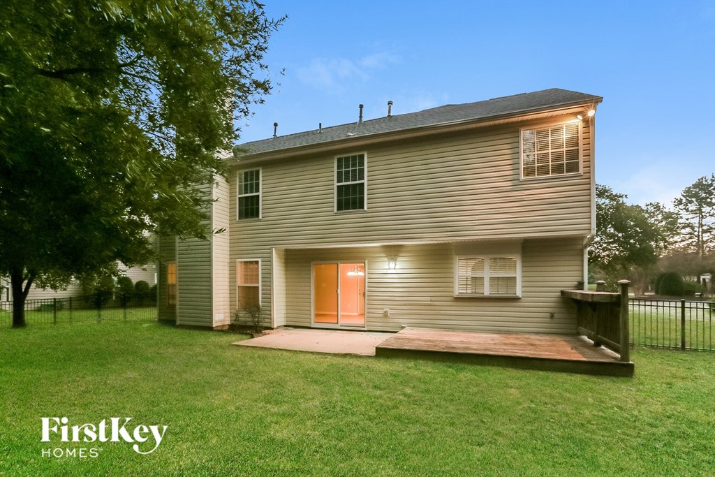 A house with a brown roof and a porch is shown.