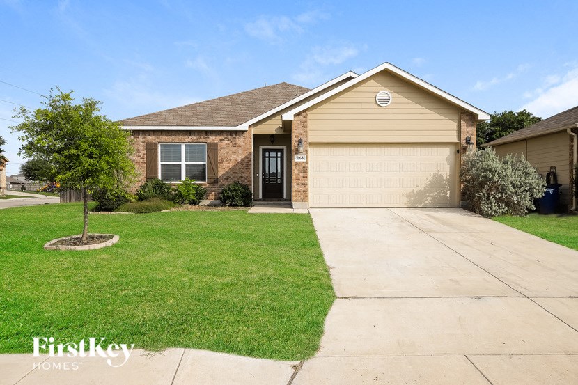 a house with a driveway and a garage door