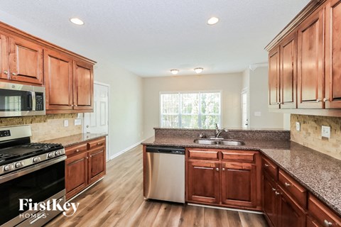 a kitchen with wooden cabinets and a counter top