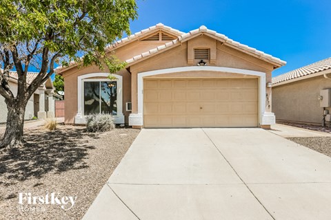 a garage door in front of a house with a driveway