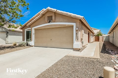 a garage door on a house with a concrete driveway