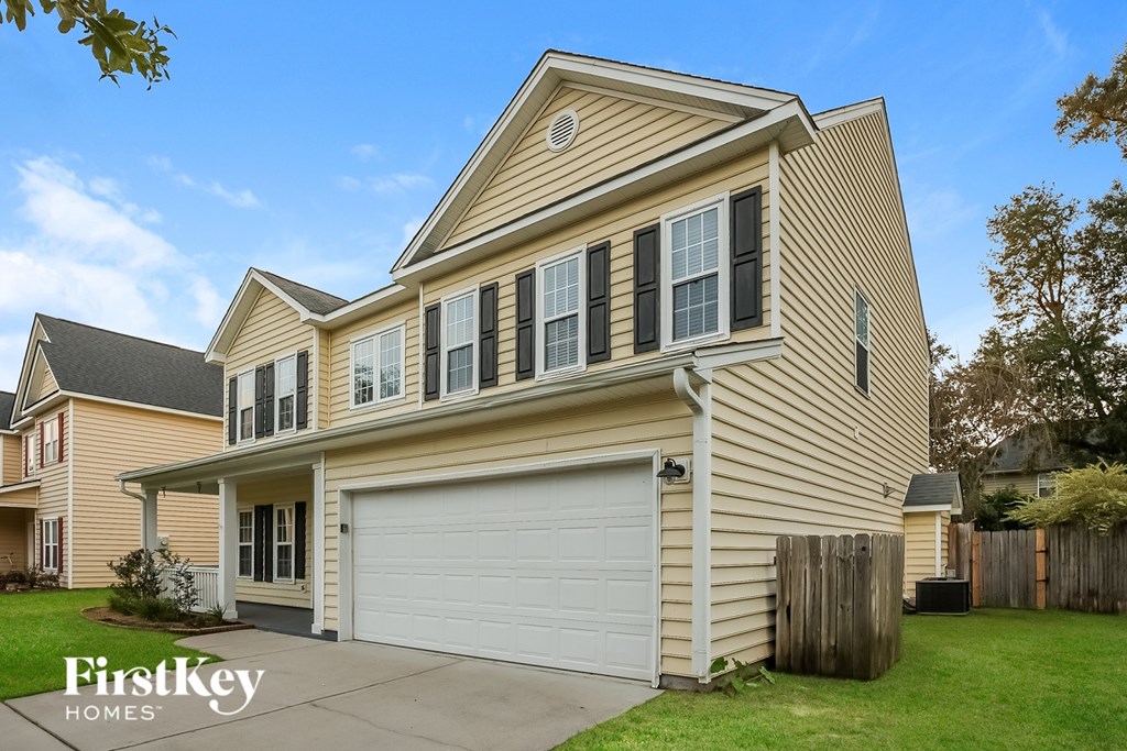 A two-story house with a garage is for sale by FirstKey Homes.