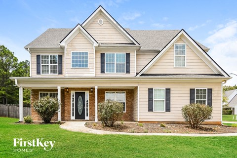 a house with a front yard and grass