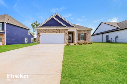A house with a garage is for sale by FirstKey Homes.