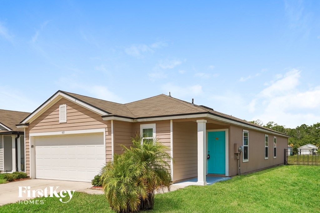 A house with a blue door is for sale by FirstKey Homes.