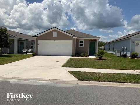 a house with a driveway and a garage door