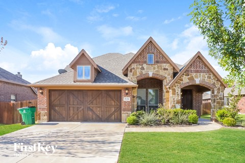 a house with a driveway and a garage door