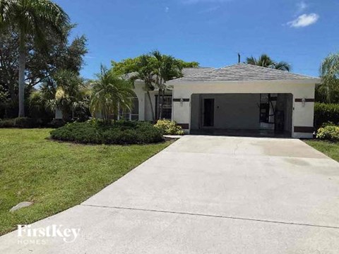 a house with a driveway and a garage door