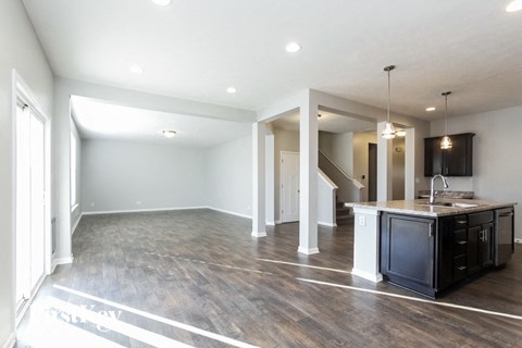 A kitchen area with a sink and a countertop.