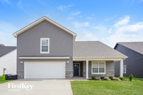 a gray house with a white garage door