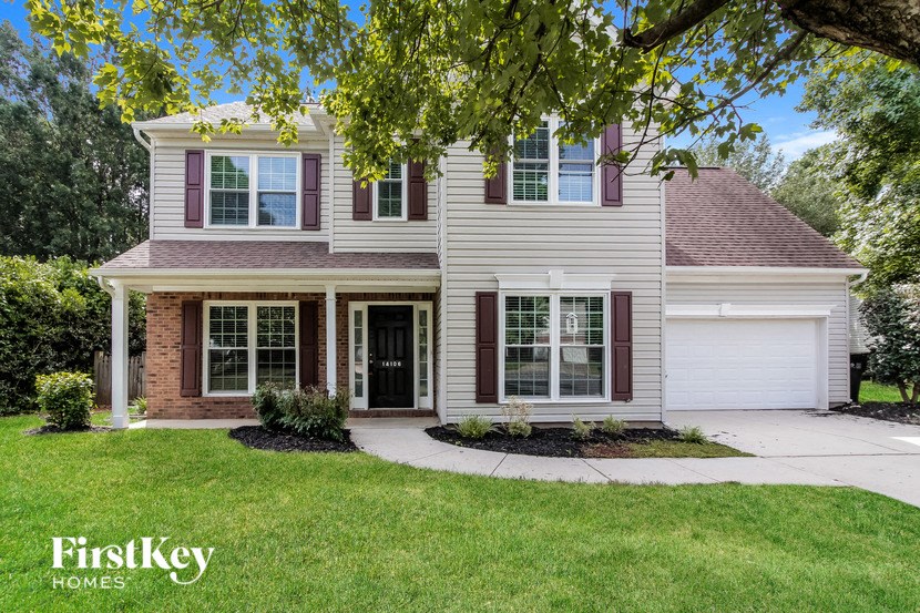 a house with a sidewalk in front of it