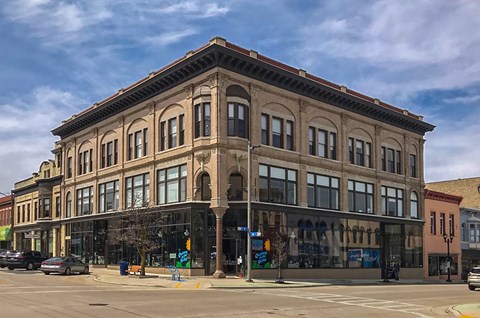 an old building on the corner of a city street