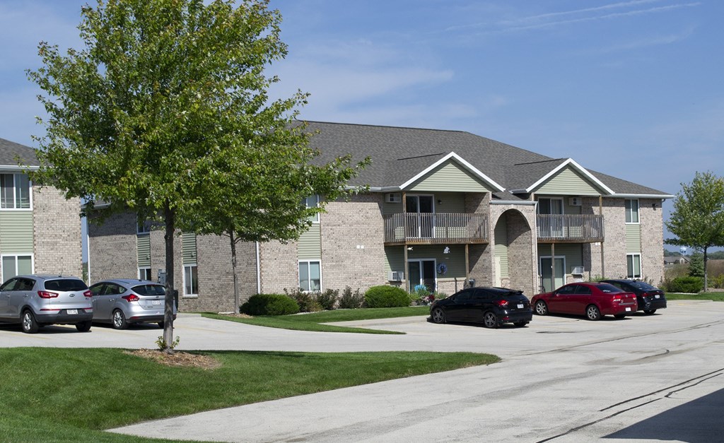 a building with cars parked in front of it