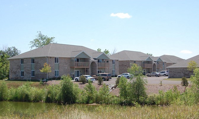 a building with cars parked in front of it